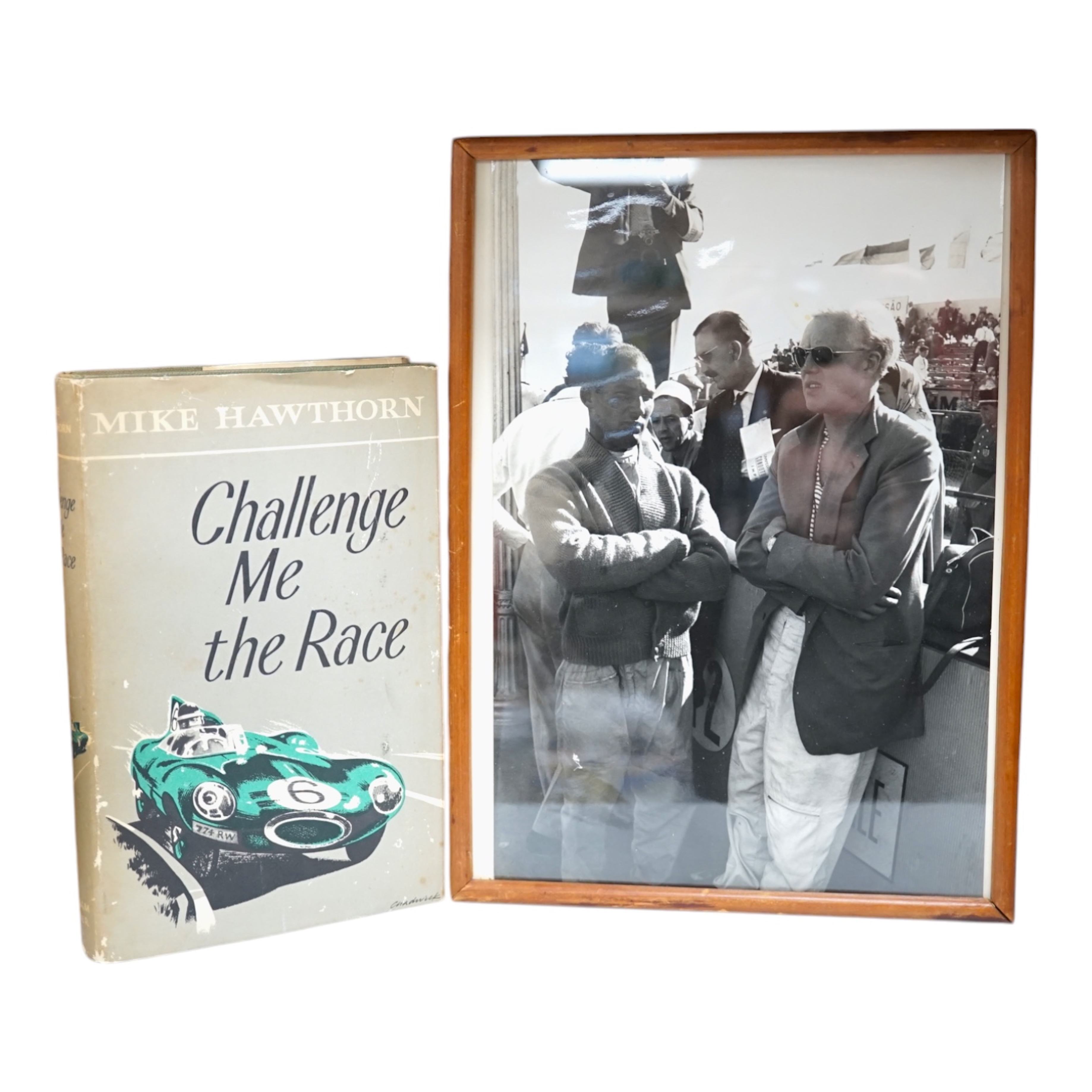 Mike Hawthorn, Challenge me the Race, signed third edition hardback book, together with a framed photograph of Mike Hawthorn, and a press photo of Mike Hawthorn and Stirling Moss (3) Condition - fair